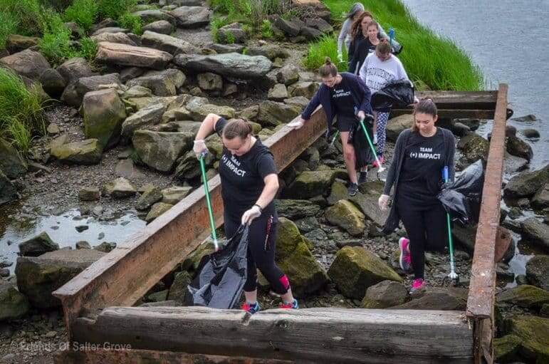 [CREDIT: FoSG] Alex and Ani employees helped clean up the Salter Grove causeway recently.