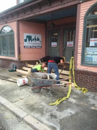 [CREDIT: Central RI Chamber] Construction workers set the forms for the new front ramp at the Victorian Lady. 