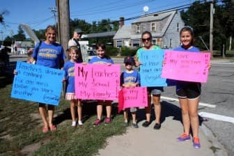 [CREDIT: Beth Hurd] Members of the Simcoe, Strauss and Spolidora families, students of Randall Holden Elementary School, one of two schools slated for closure in the current elementary schools consolidation plan, joined teachers in the picket. 