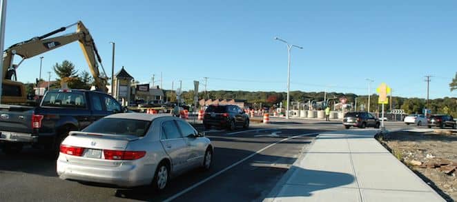 [CREDIT: Rob Borkowski] Cars turn down the new Veterans Memorial Drive Extension Friday morning after the new roundabout at the corner of Greenwich Avenue and Veterans Memorial Drive opened on all sides.