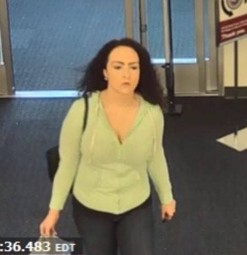 [CREDIT: WPD] Warwick Police are asking the public's help identifying a woman caught on video taking cash from another woman's purse Oct. 11 at Burlington Coat Factory.
