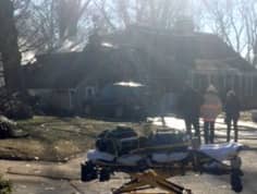 [CREDIT: William Leuropa] Firefighters clean up after putting out a garage fire at 10 Dutch Ct. Friday.