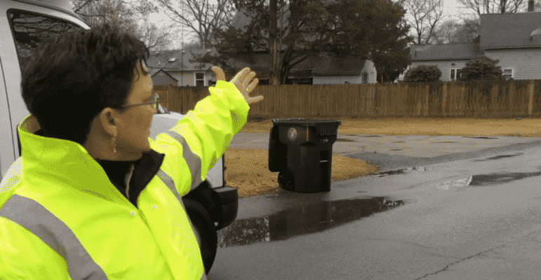 [CREDIT: Rob Borkowski] Janine Burke-Wells, executive director of the WSA, points out the smoke from a nearby house's vents, the only spot smoke pumped into the sewer system is supposed to come from.