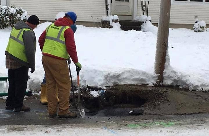 [CREDIT: Mike Dooley] A Warwick Water Department crew makes a repair of a water main break on Maple Street.