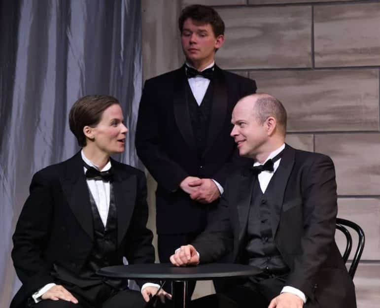 [CREDIT: Mark Turek] Eden Casteel as Victoria Grant and Christopher Swan as King Marchan become acquainted, while Ben Salus as bodyguard “Squash” Bernstein looks on in the charming, provocative, hilarious musical, Victor/Victoria, at OSTC through May 21.