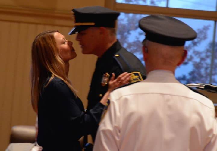 [CREDIT: Rob Borkowski] Steven Major, promoted to the rank of Sergeant, exchanges a brief kiss with his girlfriend, Jessica Bejma.