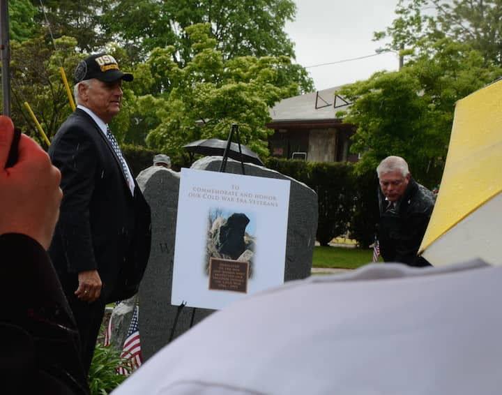 [CREDIT: Rob Borkowski] Councilman Ed Ladouceur unveils a drawing of the new Cold War monument during 2017 Memorial Day ceremonies in front of Warwick Veterans Jr. High.