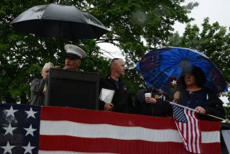 [CREDIT: Rob Borkowski] Dennis Lawton (Gunnery Sgt. ret. 1985), left, honored Councilwoman Donna Travis for her commitment to Memorial Day observances.