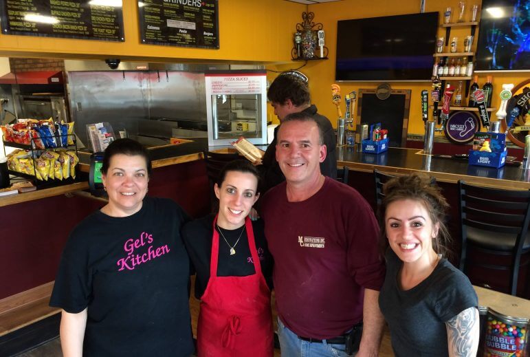 [CREDIT: Rob Borkowski] From left, Lori Mirabella, Angelica Penta, Mike Penta, and Alisha Penta inside the new Mike & Gel's Pizza during their opening day April 29.