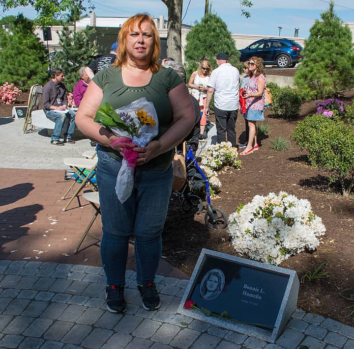 [CREDIT: Mary Carlos] Claire Bruyere, next to the stone dedicated to her daughter, Bonnie Hamelin.
