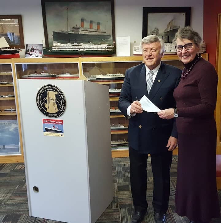 [CREDIT: SSHSA]  Heritage Harbor Foundation President Dr. Patrick T. Conley presents a $20,000 check to Steamship Historical Society President Mary Payne at an event on April 7 at the Ship History Center in Warwick. The money will be used to help build an interactive website experience to share archives and documents from SSHSA’s archives with the rest of the world. 