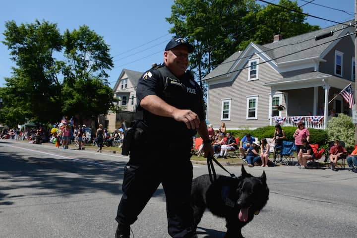 [CREDIT: Rob Borkowski] Ptlm. Paul Wells and his partner, K9 Fox, at the start of the 2017 Gaspee Day Parade.