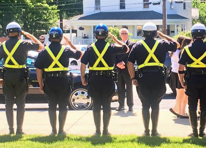 [CREDIT: Beth Hurd] WPD honor guard stand at attention outside St. Benedict Church after accompanying the funeral procession of Mayor Eugene J. McCaffrey, Jr. from the Quinn Funeral Home on Monday, June 26.