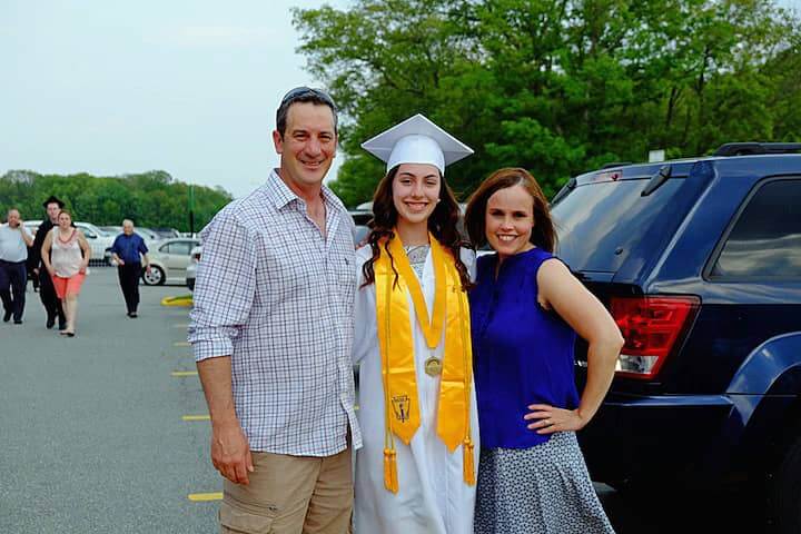[CREDIT: Lauren Kasz] Salutatorian Chelsea Lavallee poses for a photo with her parents before heading off to practice her speech.at CCRI during the Pilgrim High School Class of 2017 graduation.