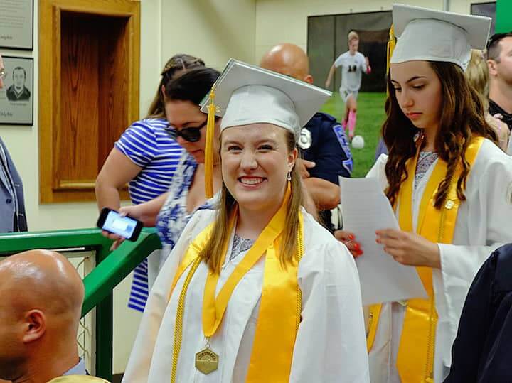 [CREDIT: Lauren Kasz] Valedictorian Alexandrea Pouliot flashes a huge grin just before the ceremony began at CCRI during the Pilgrim High School Class of 2017 graduation.