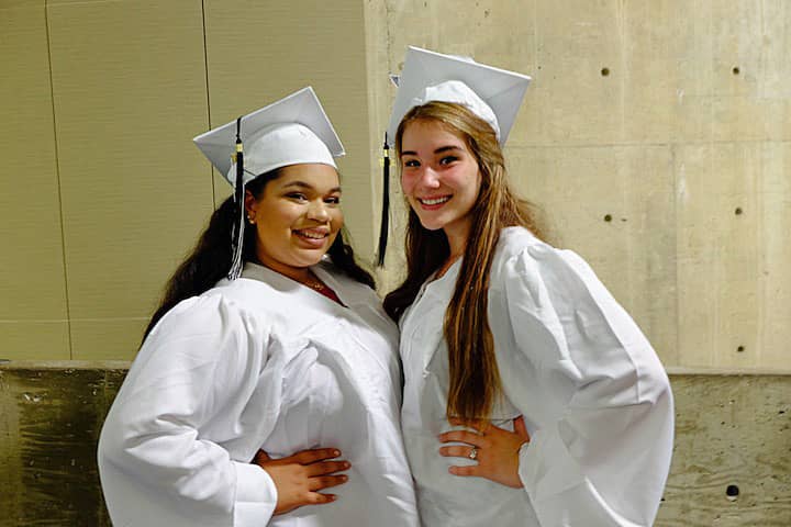 [CREDIT: Lauren Kasz] Friends Kianna French and Victoria Ferri discuss their pre-graduation jitters before posing for a quick photo.at CCRI during the Pilgrim High School Class of 2017 graduation.