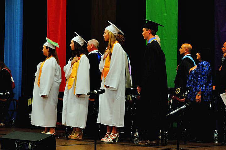 [CREDIT: Lauren Kasz] Class officers and graduation speakers take the stage at CCRI during the Pilgrim High School Class of 2017 graduation.
