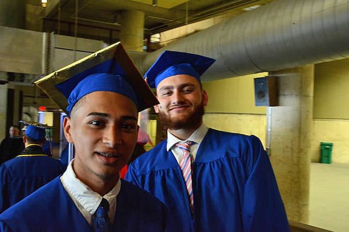 [CREDIT: Rob Borkowski] Alexis Beltran and Umair Ayaz wait for to enter the field house Tuesday at CCRI for Toll Gate High's 2017 graduation. "I'm going to help people," after studying psychology, Beltran said. Ayaz said he intends to help rebuild roads and infrastructure as an engineer.