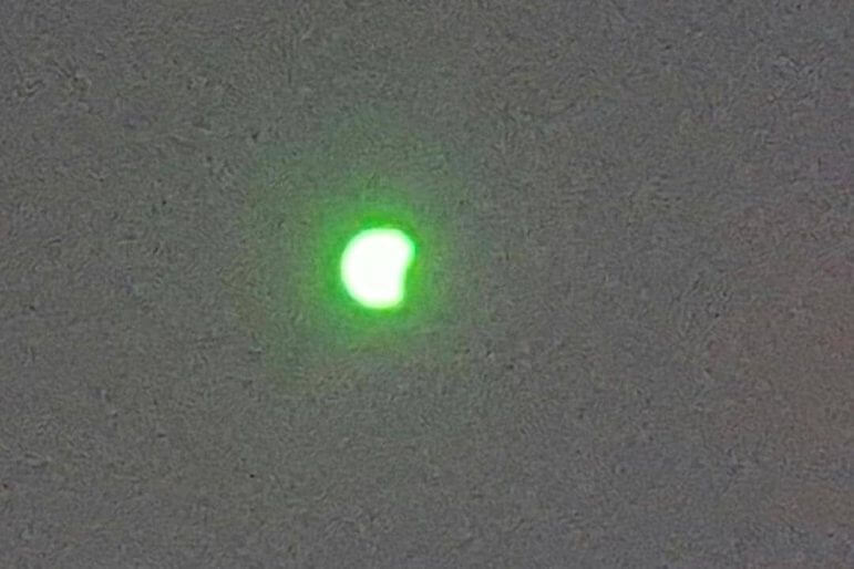 [CREDIT: Justin Suttles] A view of the 2017 eclipse, viewed through welder's glass at TF Green Airport. 