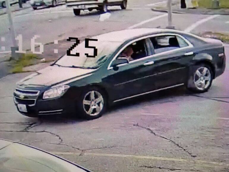[CREDIT: Angelica Penta] A photo of a man in his car in the lot at Mike & Gel's Pizza who attempted to pass a fake $100 bill.