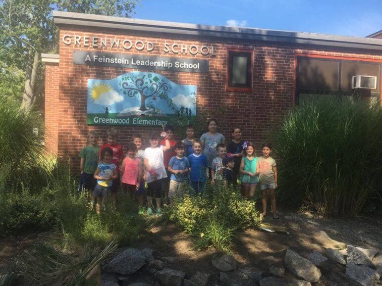 [CREDIT: Friends of Greenwood] Greenwood Elementary's PTO and other members of the community spent some time cleaning up the school grounds Aug. 28 in anticipation of the first day of school. 
