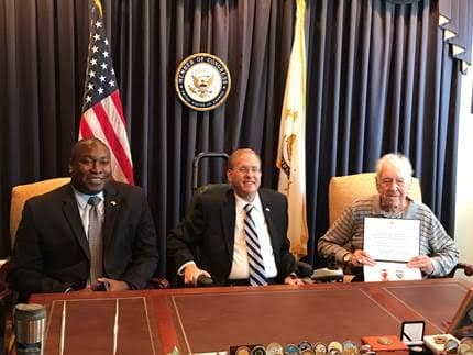 [CREDIT: Congressman Jim Langevin's office] Pictured above and attached (from left to right) are Rhode Island Director of Veterans Affairs Kasim Yarn, Congressman Langevin, and WWII veteran Johnson.