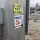[CREDIT: Rob Cote] A political sign on a traffic control box at the intersection of Buttonwoods Avenue and West Shore Road.