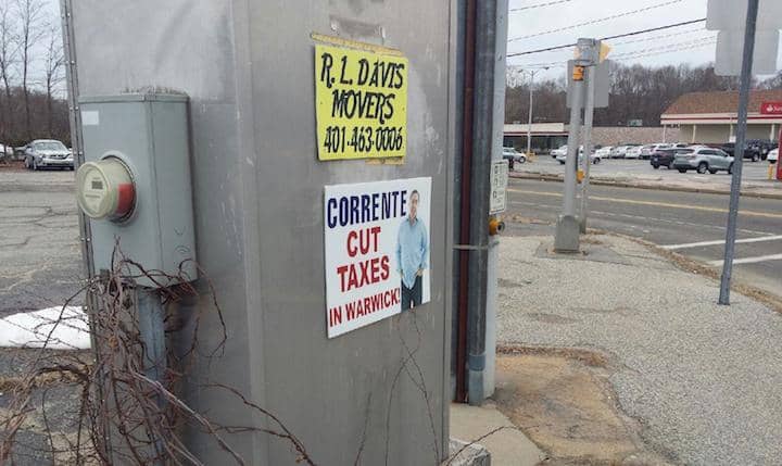 [CREDIT: Rob Cote] A political sign on a traffic control box at the intersection of Buttonwoods Avenue and West Shore Road.