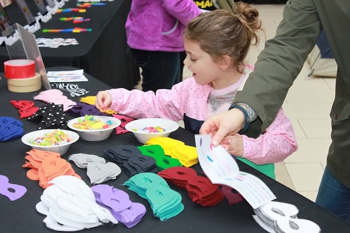 [CREDIT: (GSSNE] Scouts enjoyed making masks during the Girl Scout's event at the Warwick Mall.