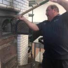 [CREDIT: Frank Pepe Pizzeria Napoletana] Gary Bimonte, owner of Frank Pepe's Pizza  fired up the pizzeria's coal pizza oven Monday.
