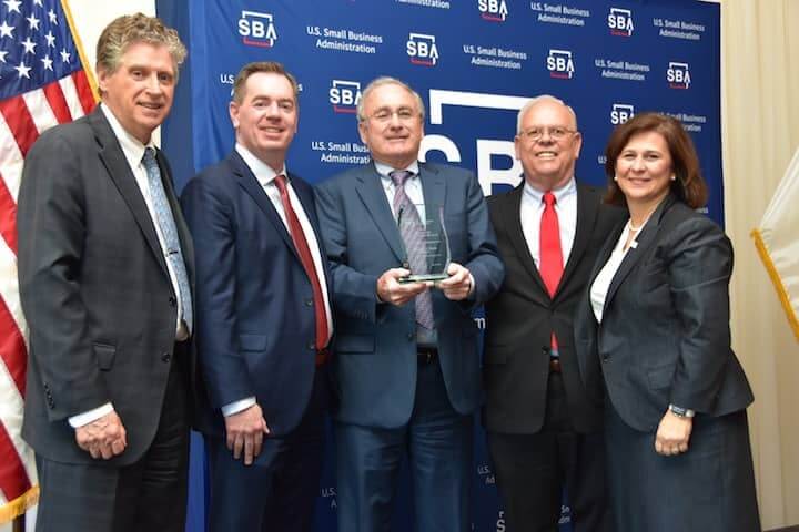 [CREDIT: Ryan Brissette, Small Business Administration] From left, Lieutenant Governor, Daniel J. McKee; SBA Regional Administrator, Wendell G. Davis; President of Jade Manufacturing, Donald J. Boyle; SBA District Director, Mark S. Hayward; Secretary of State, Nellie M. Gorbea during the “Salute to Small Business” luncheon on Friday, May 11, at Kirkbrae Country Club. 