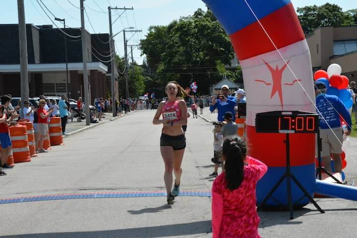[CREDIT:Rob Borkowski] Rachel Schilkowsky, 26, of Providence, won the women's division at the Gaspee Days 5K Saturday, June 10, 2018. 