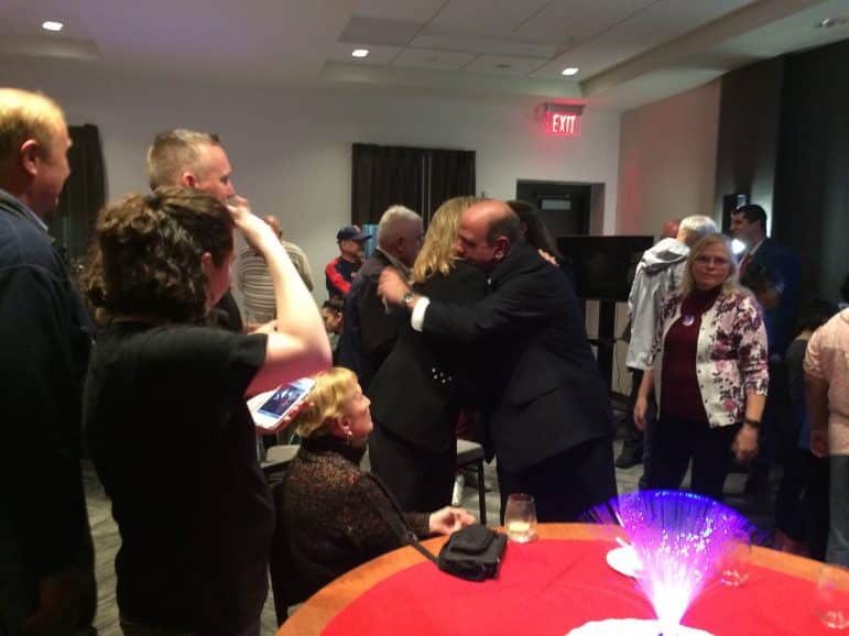 [CREDIT: Rob Borkowski] Mayor Joseph J. Solomon hugs Tourism Department Director Karen Jedson after his win at the Hyatt on Jefferson Boulevard.