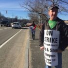 [CREDIT: Rob Borkowski] Mark Harold, grocery clerk at the Warwick Avenue Stop & Shop in Warwick, and K.D. Sabaria, front end manager at the store, wave to passing motorists honking in support of the striking workers Tuesday.