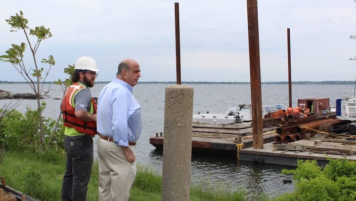 [CREDIT: Mayor Solomon's Offiice] Mayor Joseph Solomon observes the start of work to demolish the Rocky Point pier.