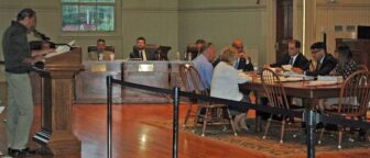 [CREDIT: Rob Borkowski] Rob Cote, left, asks questions about the DPW budget, including compensation and paving line items, during budget hearings May 29, 2019.