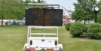 [CREDIT: Robert Ford] An electronic messaging sign urging Coventry voters to get out and vote on the revised town and school budgets, June 13 stands at the intersection of Sandy Bottom and Tiogue Avenue.