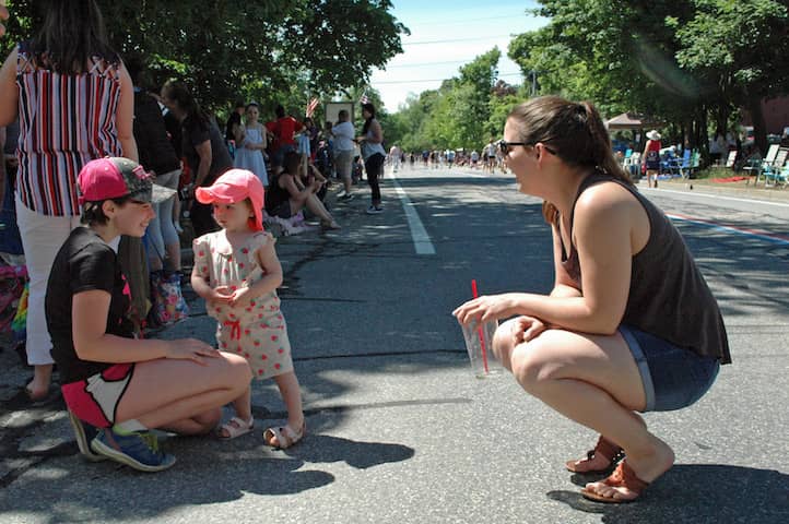 [CREDIT: Rob Borkowski] At center, Riley Jean, 18 months, and her aunt, Trina, right, make a new friend while waiting for the 2019 Gaspee Days Parade Saturday, June 8.