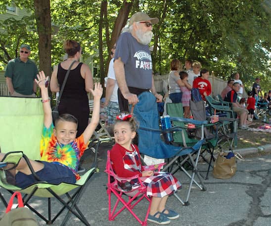 [CREDIT: Rob Borkowski] Cayden Montoya and Jayda Miller wait for the 2019 Gaspee Days Parade Saturday, June 8. With them, standing at right, is Jayda's grandfather, Robert Miller.