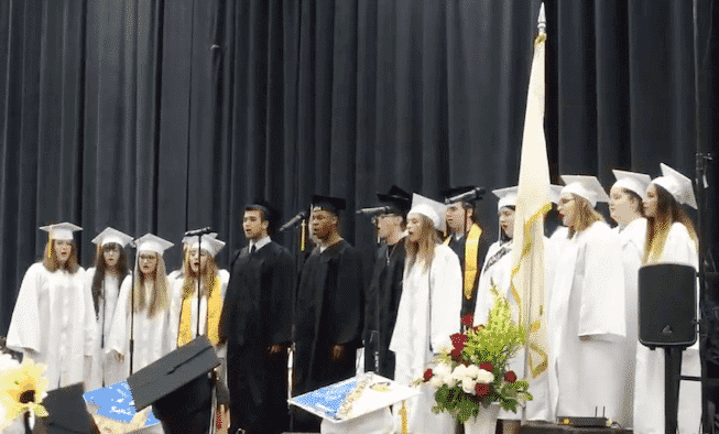 {CREDIT: Kim Wineman] The Pilgrim High School Senior Band and Chorus performed Pilgrim's Alma Mater and He Ain't Heavy, He's My Brother Wednesday night at the CCRI field house during the Pilgrim High School 2019 graduation.