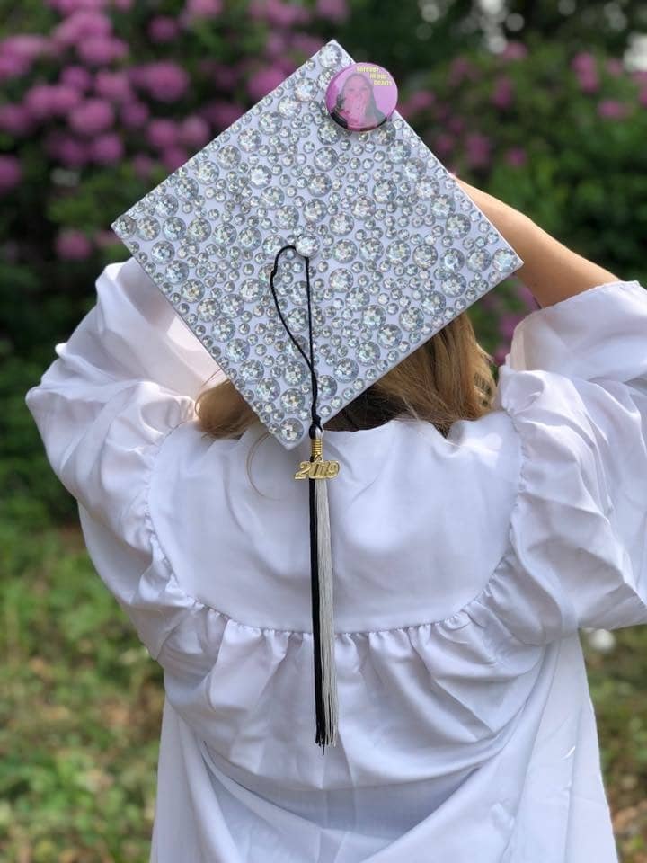 {CREDIT: Kim Wineman] Nicara Pierce outside CCRI following graduation for Pilgrim High's Class of 2019. The button on her cap depicts a close friend, Maribeth, who just passed away from breast cancer.