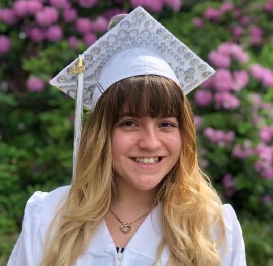 {CREDIT: Kim Wineman] Nicara Pierce outside CCRI following graduation for Pilgrim High's Class of 2019. The button on her cap depicts a close friend, Maribeth, who just passed away from breast cancer.