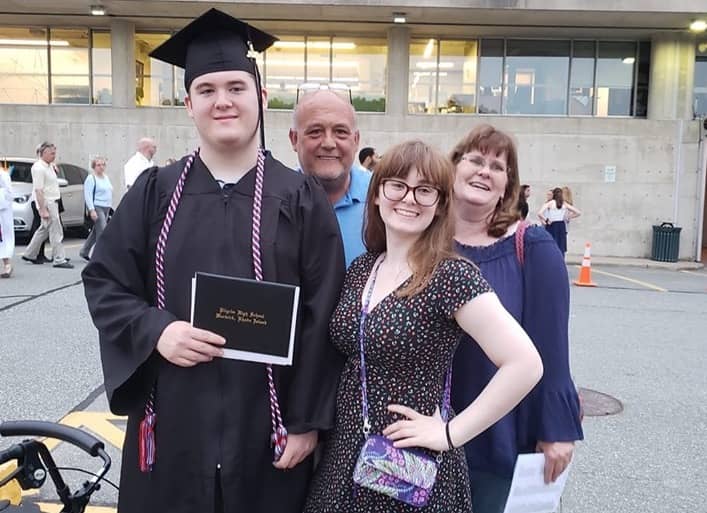 [CREDIT: Kim Wineman] Graduate and Eagle Scout Eion Daniels shows off his new diploma outside CCRI following Pilgrim High's 2019 graduation. With him are his dad, Tom; mom, Colleenn, and sister, molly.