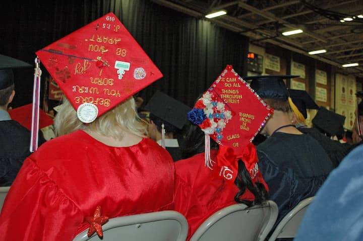  {CREDIT: Rob Borkowski] Graduates listen to a few speeches as they wait during graduation at the CCRI field house June 6.