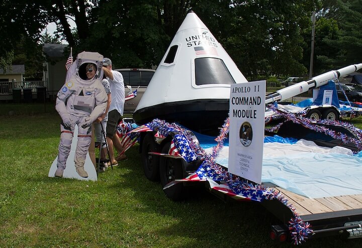 [CREDIT: Mary Carlos] Lori Masse poses for a photo in an astronaut cutout after the Conimicut Apollo 11 parade July 20, 2019.