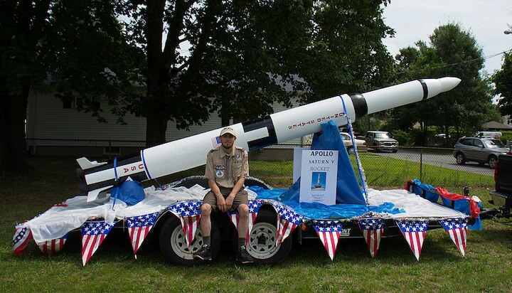 [CREDIT: Mary Carlos] Eagle Scout William Conklin poses with the Troop 1 Conimicut model of the Saturn V rocket after the Conimicut Apollo 11 parade July 20, 2019.