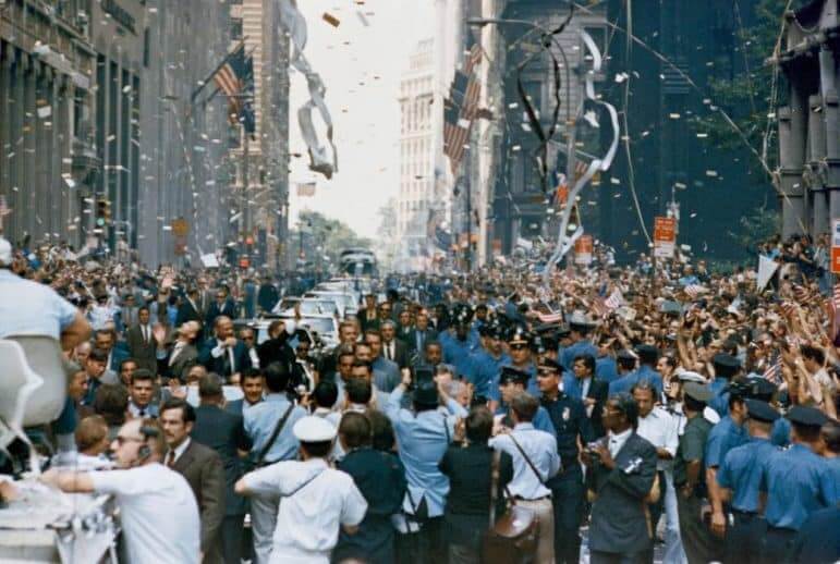 [CREDIT: NASA} New York City welcomes the Apollo 11 crew in a ticker tape parade down Broadway and Park Avenue. Pictured in the lead car, from the right, are astronauts Neil A. Armstrong, Michael Collins and Buzz Aldrin. The three astronauts teamed for the first manned lunar landing, on July 20, 1969.