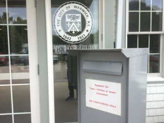 [CREDIT: Rob Borkowski] A tax and utility bill drop box outside the Buttonwoods Community Center. Many property tax bills were delivered this week, two business days before the July 15 due date.