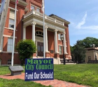 [CREDIT: Danny Hall] One of several yard signs Danny Hall has printed up protesting officials delayed action on a $7 school deficit.