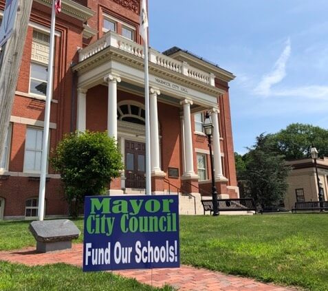 [CREDIT: Danny Hall] One of several yard signs Danny Hall has printed up protesting officials delayed action on a $7 school deficit.